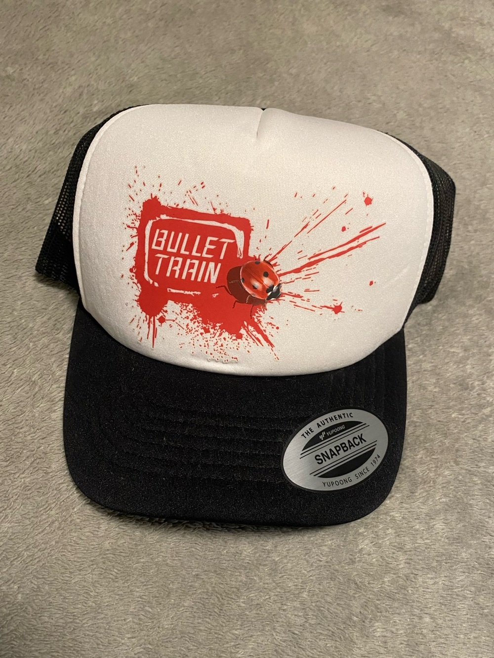 Bullet Train Crew Black and White Trucker Hat with Red Bullet Train Graphic